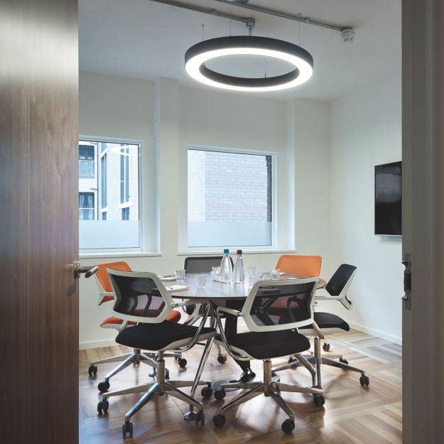 Us&Co meeting room in Central London, meeting space with natural lighting complete with office chairs & round office table.