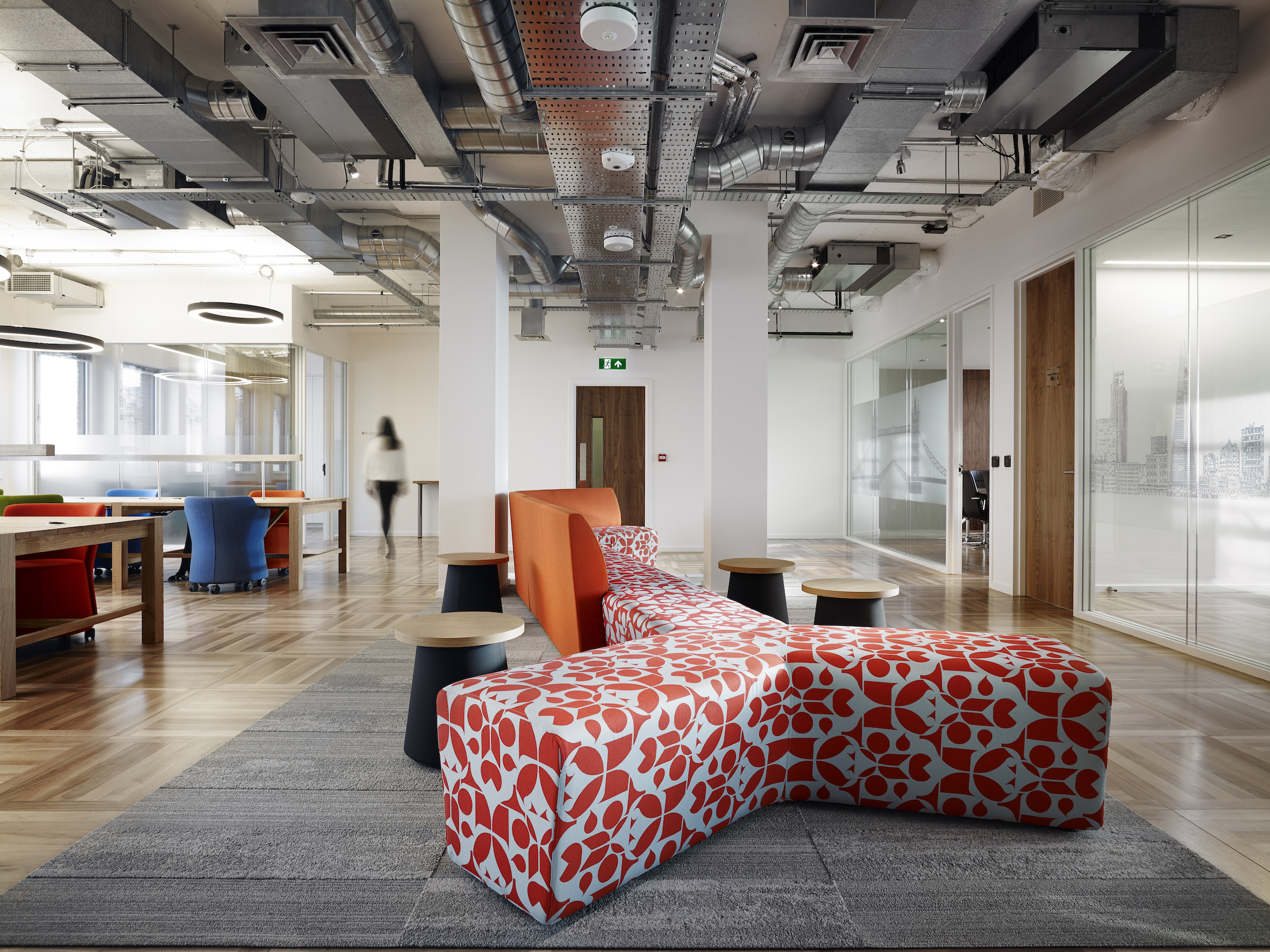 Colourful sofa's and tables in US&Co co-working space